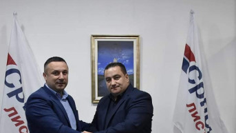 Popović i Ristović se rukuju 