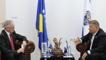 Džerard Mekgark i Gazmend Hodža