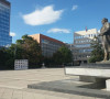 Rugovin spomenik, zgrada Skupštine i Vlade u Prištini